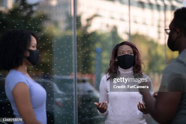 young adults discussing outside - mask debate stock pictures, royalty-free photos & images