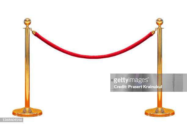 gold stanchions on white background - red carpet foto e immagini stock