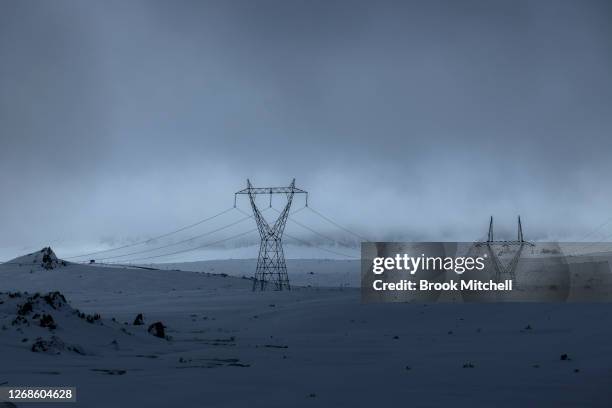 Power lines connected to the Snowy hydro electric scheme are seen running through Kosciuszko National Park as record snowfall impacts the region on...