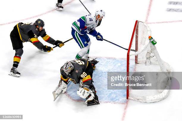 Elias Pettersson of the Vancouver Canucks scores a goal past Robin Lehner of the Vegas Golden Knights during the second period in Game Two of the...