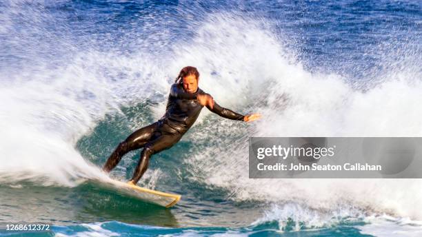 tunisia, surfing in the mediterranean sea - tunisia surfing one person stock pictures, royalty-free photos & images