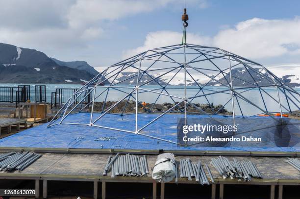 Dome structure being assembled with the help of a crane on the floor for the opening ceremony of Comandante Ferraz Station on January 10, 2020 in...