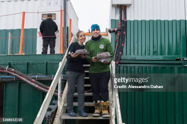 Official Doctor of the Brazilian Navy and Station Cook bringing a snack to the workforce on January 10, 2020 in King George Island, Antarctica.