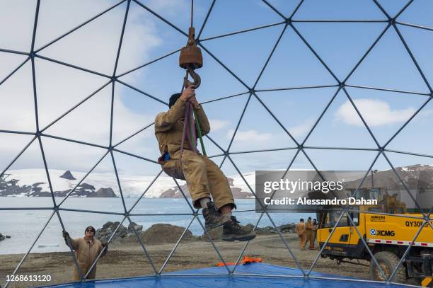 Detail of the Navy Officer descending from the dome structure of the guests area of the opening ceremony of the Comandante Ferraz Station after the...