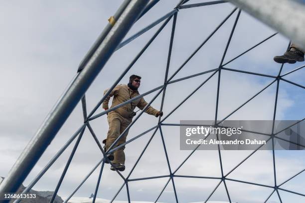 Detail of the Navy Officer finishing assembly of the dome structure in the area of the guests of the opening ceremony of the Comandante Ferraz...