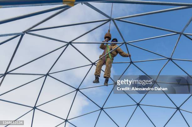 Detail of the Navy Officer descending from the dome structure of the area of the guests of the opening ceremony of the Comandante Ferraz Station...