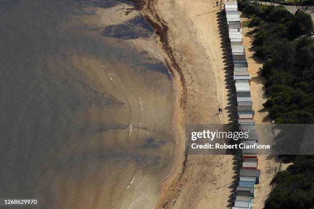 View of the Brighton Beach bathing boxes, on August 26, 2020 in Melbourne, Australia. Melbourne is in stage four lockdown for six weeks until...