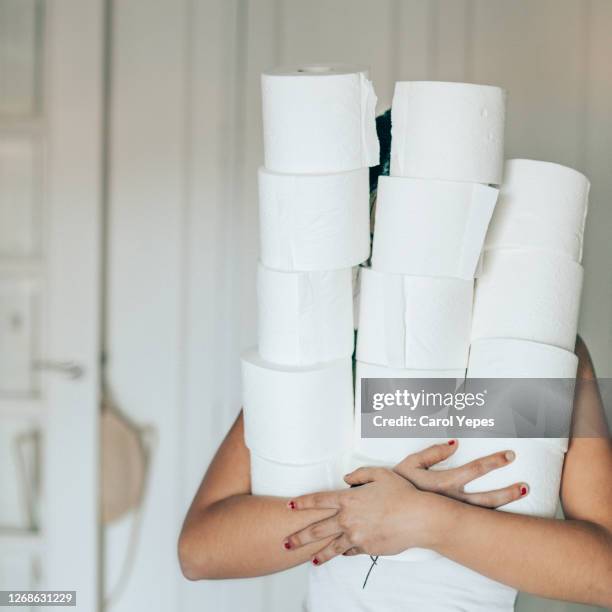 woman holding toilet papers against white background - teasing stock pictures, royalty-free photos & images
