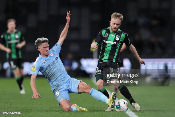 Connor Pain of United is challenged by Lachlan Wales of Melbourne City during the A-League Semi Final match between Melbourne City and Western United...