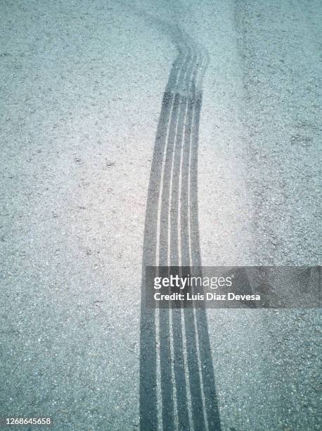 tire tracks - skid marks stock pictures, royalty-free photos & images