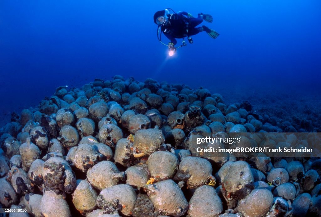 Divers and antique amphorae, Mediterranean Sea, Spain