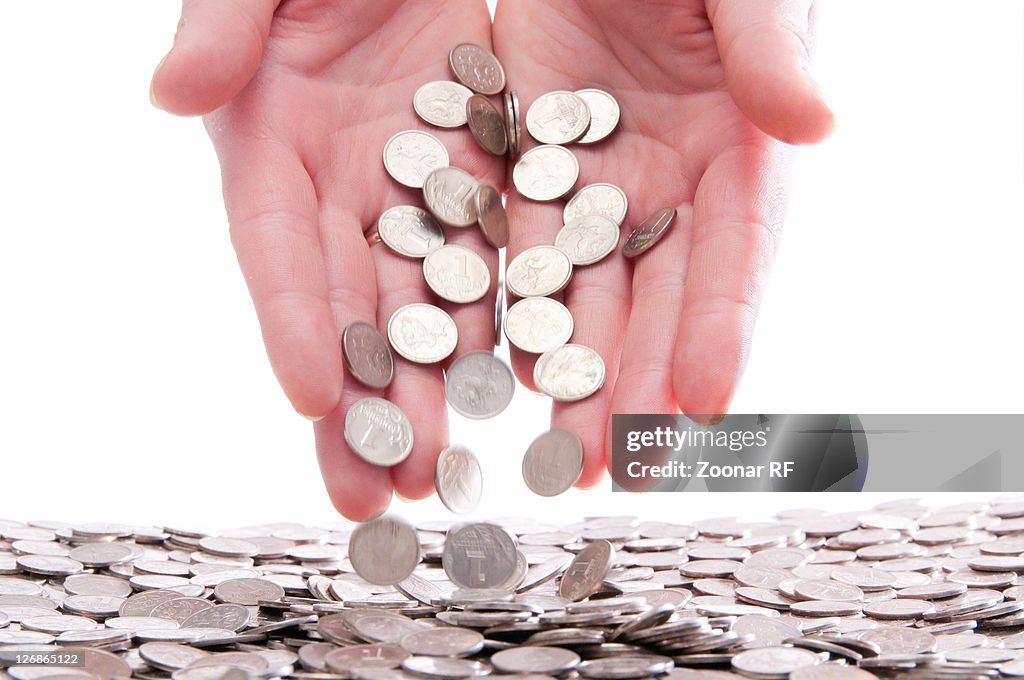 Coins in the hands of