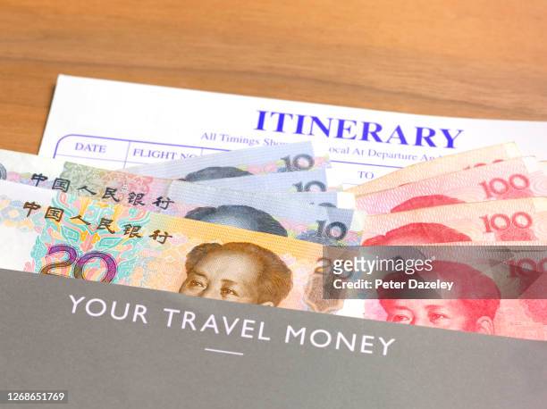 yuan banknotes in travel wallet - 20 yuan note stock pictures, royalty-free photos & images