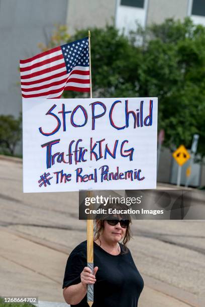 St. Paul, Minnesota, Save our children protest, Protester holding a stop child trafficking sign.