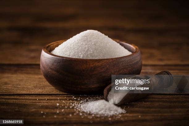 white sugar on a wooden bowl - xylitol stock pictures, royalty-free photos & images
