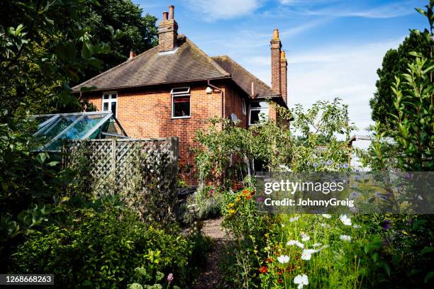 two-story brick house and garden in southeast england - english garden stock pictures, royalty-free photos & images