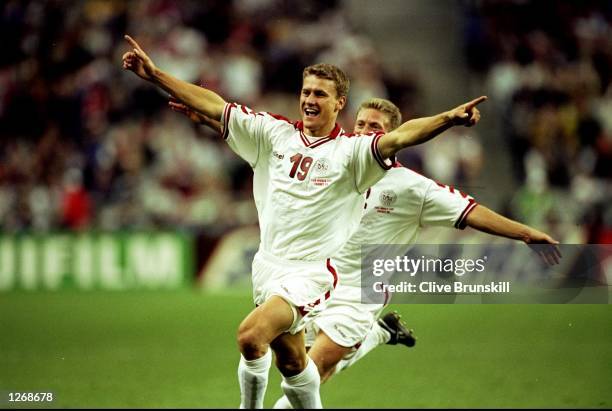 Ebbe Sand of Denmark celebrates his goal during the World Cup second round match against Nigeria at the Stade de France in St Denis, France. Sand...