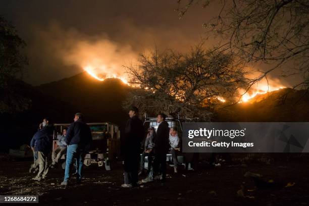 Local villagers observe wildfires from Casa Grande community on August 25, 2020 in Cordoba, Argentina. Wildfires are raging Argentina's Cordoba...