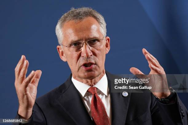 Secretary General Jens Stoltenberg speaks to the media upon his arrival at a meeting of European Union member states defence ministers on August 26,...