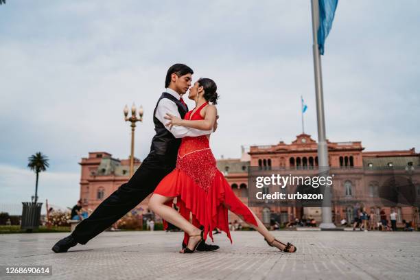 latin couple dancing tango on town square - buenos aires tango stock pictures, royalty-free photos & images