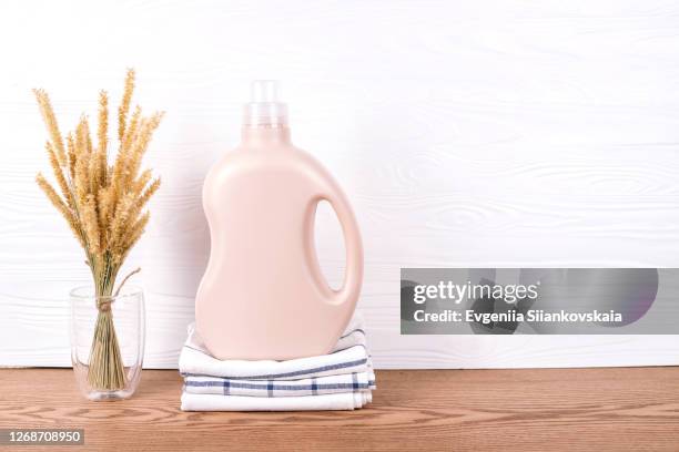detergent's bottle on a pile of towels. - lessive photos et images de collection