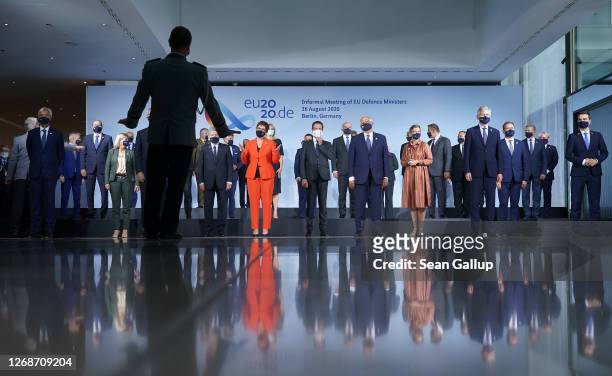 Defense ministers of European Union member states and other participants arrange themselves for a group photo during a meeting on August 26, 2020 in...