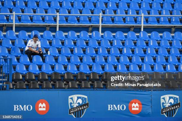 Fan sits on his own prior to the MLS game between the Montreal Impact and the Vancouver Whitecaps at Saputo Stadium on August 25, 2020 in Montreal,...