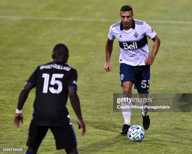 Ali Adnan of the Vancouver Whitecaps controls the ball against the Montreal Impact during the second half of the MLS game at Saputo Stadium on August...