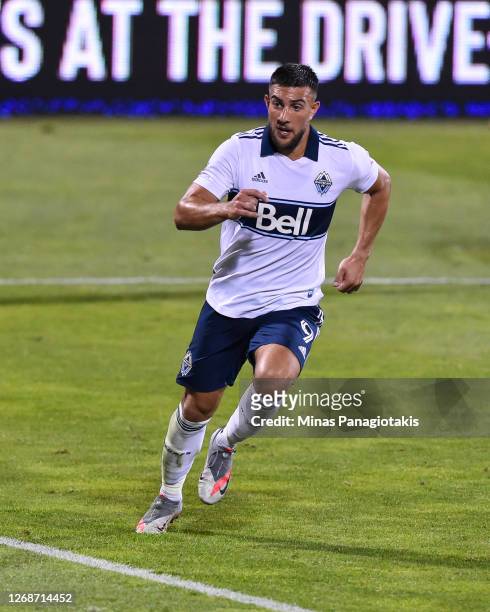Lucas Cavallini of the Vancouver Whitecaps runs against the Montreal Impact during the second half of the MLS game at Saputo Stadium on August 25,...