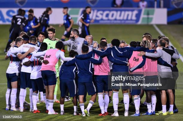 Team members of the Vancouver Whitecaps huddle prior to the MLS game against the Montreal Impact at Saputo Stadium on August 25, 2020 in Montreal,...