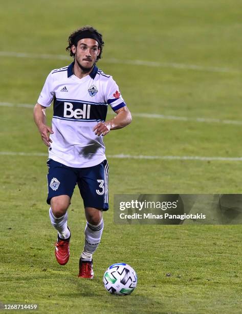 Russell Teibert of the Vancouver Whitecaps controls the ball against the Montreal Impact during the second half of the MLS game at Saputo Stadium on...