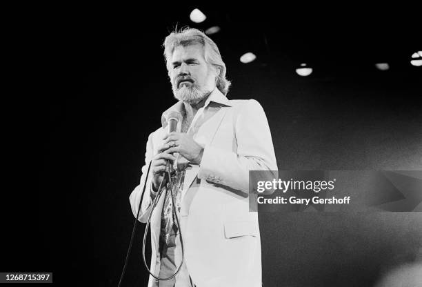 American Country musician Kenny Rogers performs onstage at Nassau Coliseum, Uniondale, New York, September 26, 1980.