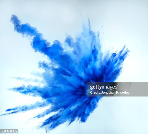 vibrant blue powder explosion - powder blue ストックフ��ォトと画像