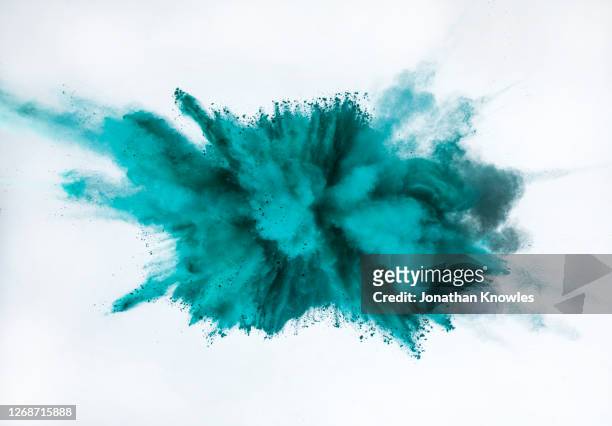 teal blue powder explosion - powder explosion stock pictures, royalty-free photos & images
