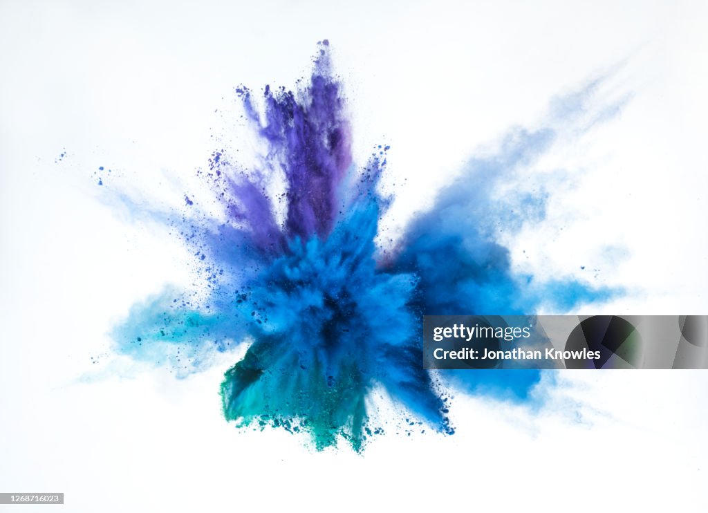 Vibrant blue and purple powder explosion