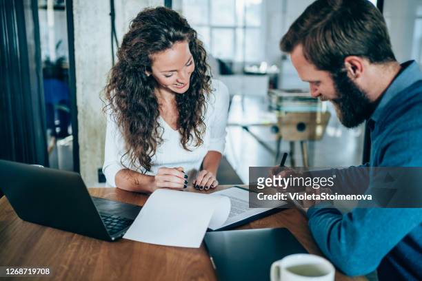 business people signing a contract. - contract stock pictures, royalty-free photos & images