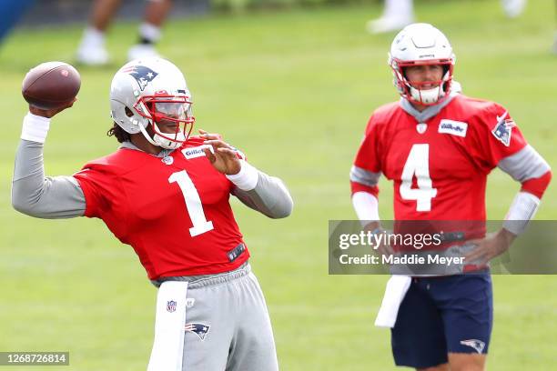 Cam Newton of the New England Patriots makes a throw as Jarrett Stidham looks on during Patriots Training camp at Gillette Stadium on August 26, 2020...