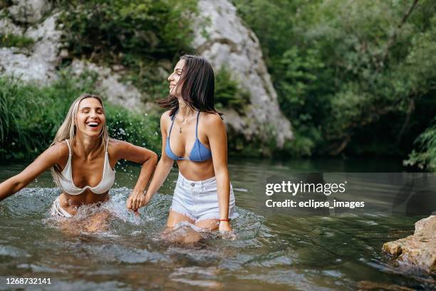 it's funny day in nature - women twins in bathing suits stock pictures, royalty-free photos & images