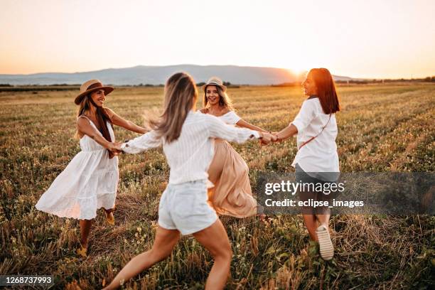 our freedom - four people holding hands stock pictures, royalty-free photos & images