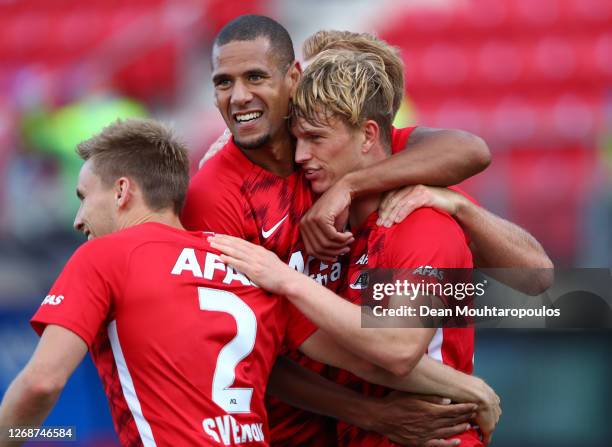 Albert Gudmundsson of Alkmaar Zaanstreek celebrates with teammates after scoring his team's third goal during the UEFA Champions League qualification...