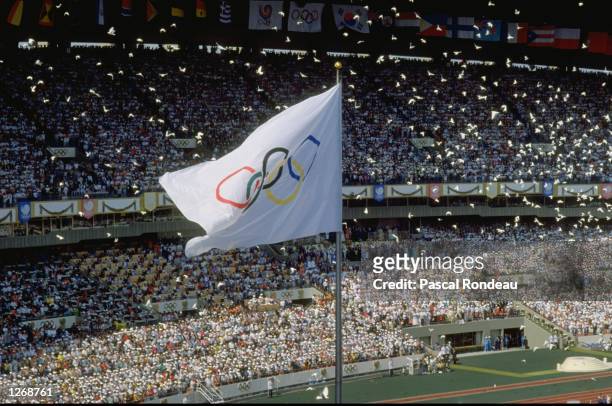 General view of the Olympic Flag in the Olympic Stadium as the doves are released during the Opening Ceremony of the 1988 Olympic Games in Seoul,...