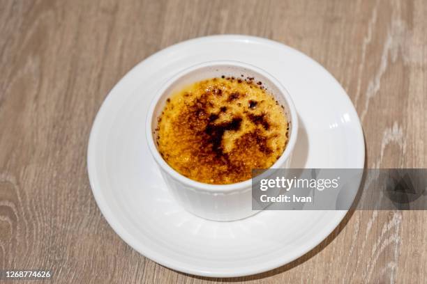 the crispy caramel pudding put on white plate - creme brulee stock pictures, royalty-free photos & images