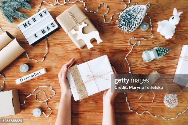 packing christmas gifts and preparing for the holiday. - table top imagens e fotografias de stock