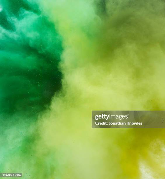 close up green and yellow powder - creativity explosion stock pictures, royalty-free photos & images