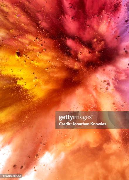 vibrant powder explosion - explosives fotografías e imágenes de stock