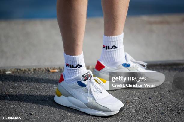 Guest is seen with sneakers and Fila socks on day 2 during Stockholm Fashion Week Digital Edition 2020 on August 26, 2020 in Stockholm, Sweden.
