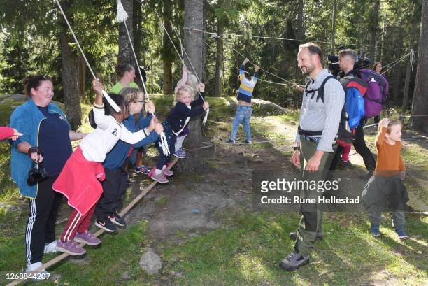 Crown Prince Haakon of Norway meets kids at Vangen ski cabin while walking the Refugee Route on August 26, 2020 in Oslo, Norway. .