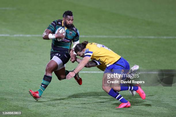 Taqele Naiyaravoro of Northampton Saints is tackled by Max Clark of Bath and Cameron Redpath of Bath during the Gallagher Premiership Rugby match...