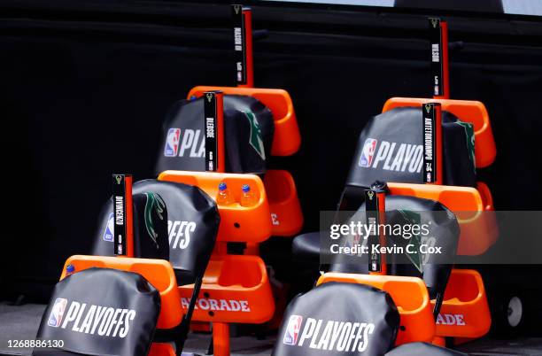 The Milwaukee Bucks bench sits empty at game time of a scheduled game between the Milwaukee Bucks and the Orlando Magic for Game Five of the Eastern...