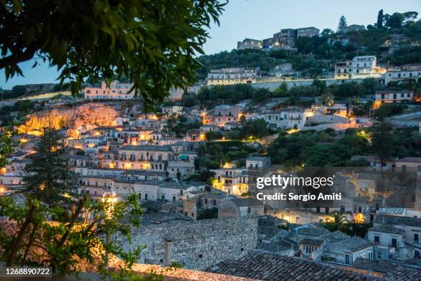 view of the picturesque town of modica at dusk - modica sicily stock pictures, royalty-free photos & images